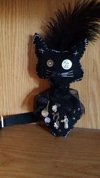 The Mystical Energies of Black Cats and Voodoo Dolls